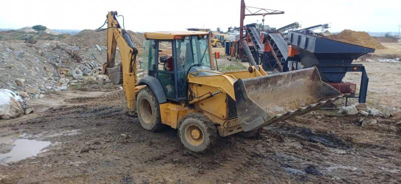 excavator trenching pipe